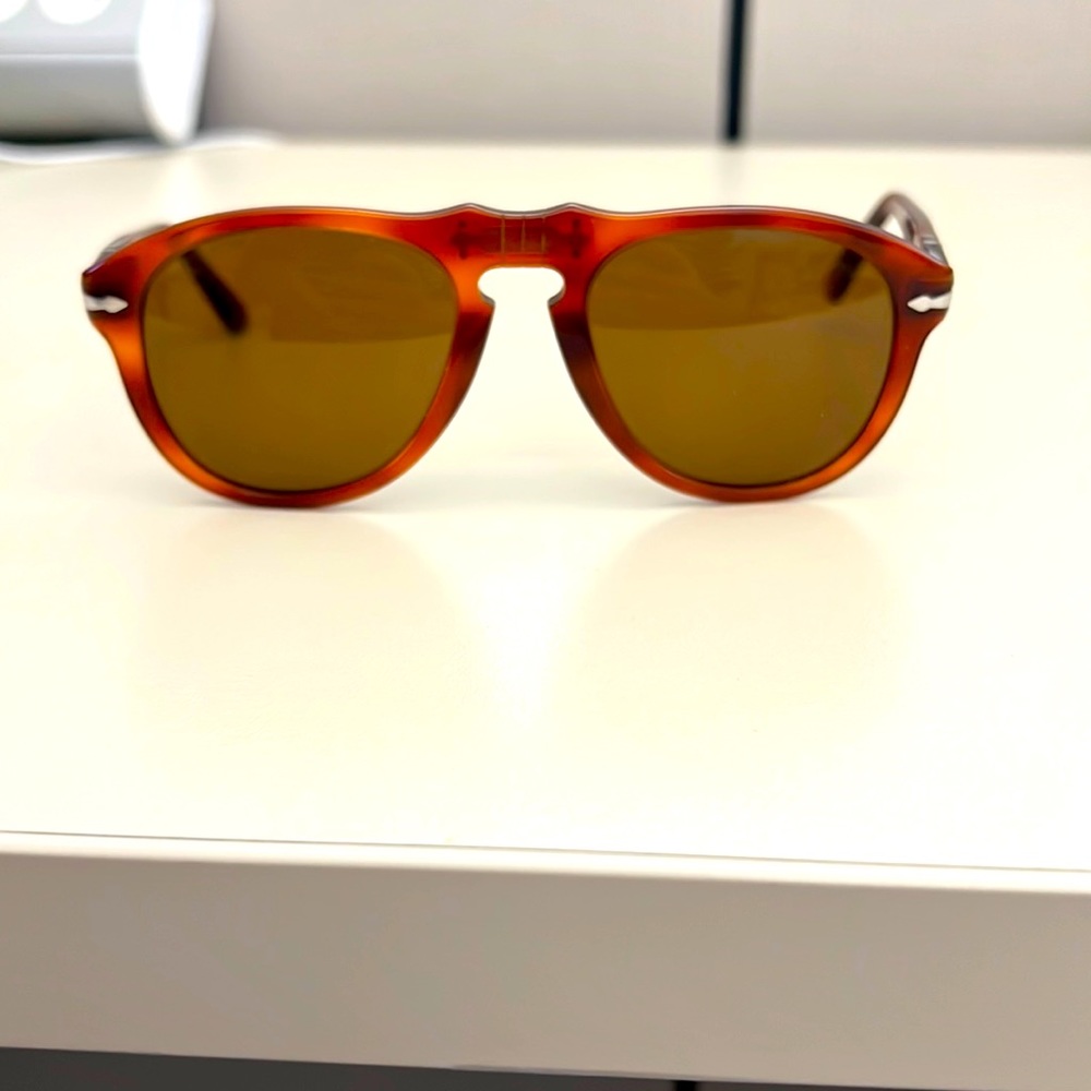 Persol 0649 size 52. Light Havana with brown lenses. Too small for big face!